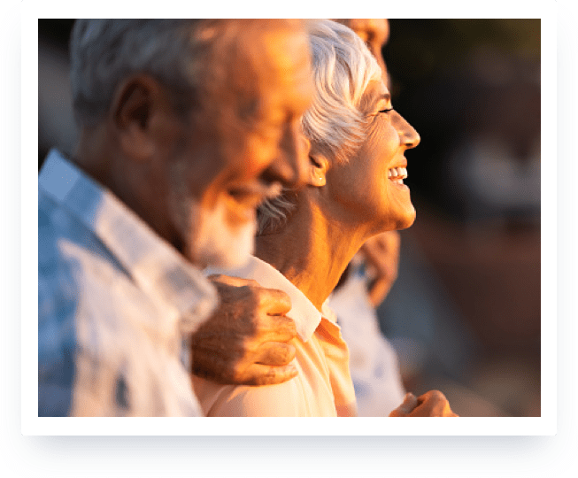 Elderly couple smiling in the sun